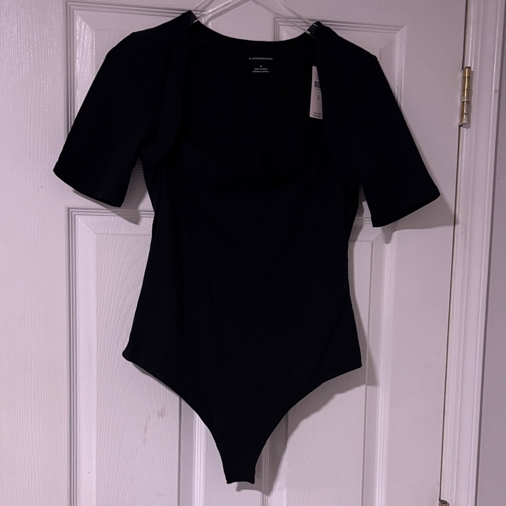 Anthropologie..Black Short Sleeve Square Neckline Bodysuit W Snap Closure… NWT